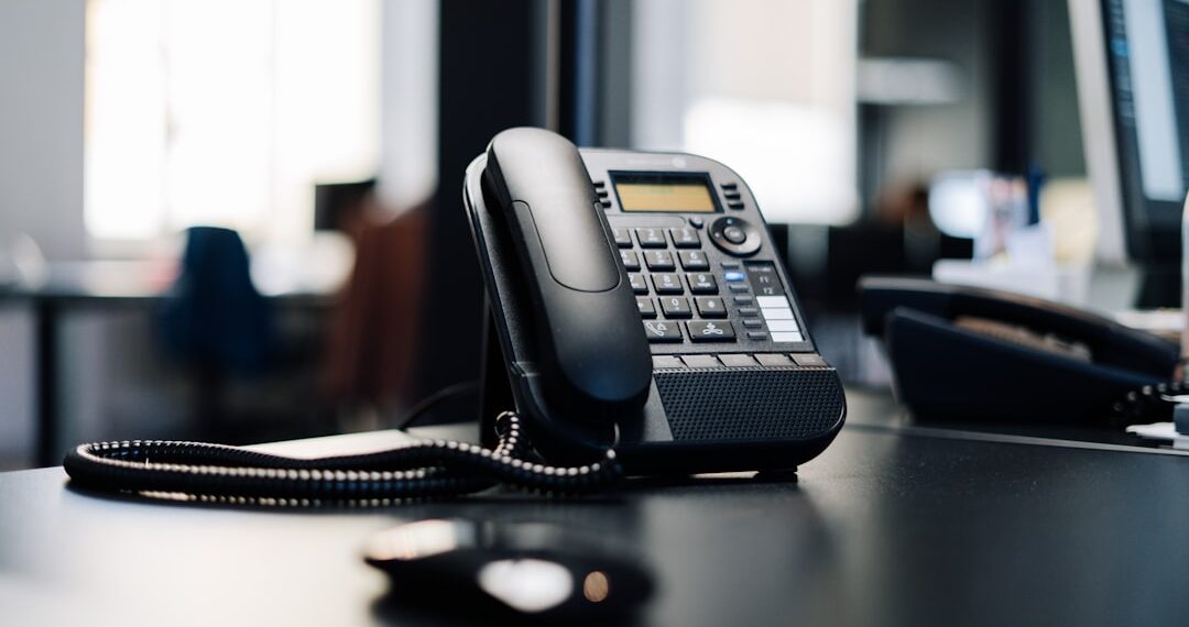 Phone on a black desk.