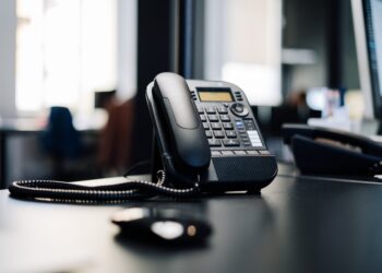 Phone on a black desk.