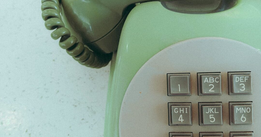 An old vintage green telephone
