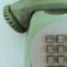 An old vintage green telephone