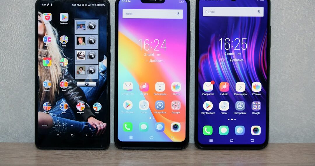 Thre different smartphones with colourful displays.
