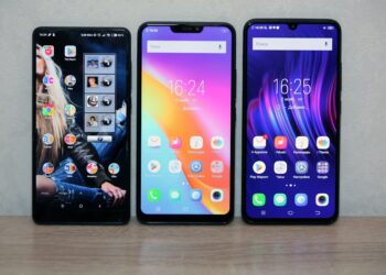 Thre different smartphones with colourful displays.